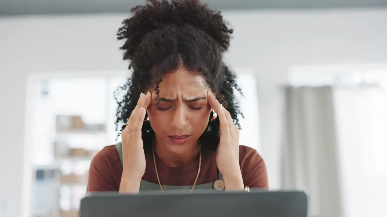 Woman laptop and headache in burnout