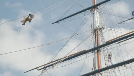 Low Angle Shot of Person Maintaining Old Cutty Sark Ship