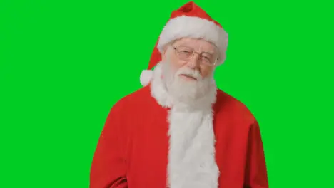 Portrait Shot of Santa Looking to Camera with a Green Screen