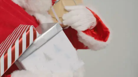 Close Up Shot of Santa Holding Presents and Gifts