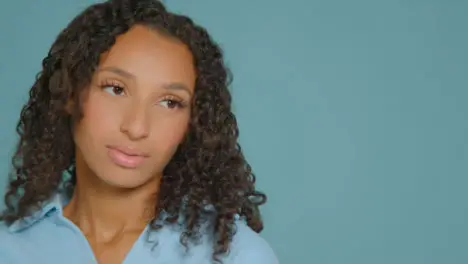 Close Up Shot of Young Adult Woman Posing for Studio Shoot with Copy Space