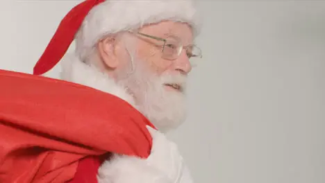 Close Up Shot of Santa Holding Sack of Presents