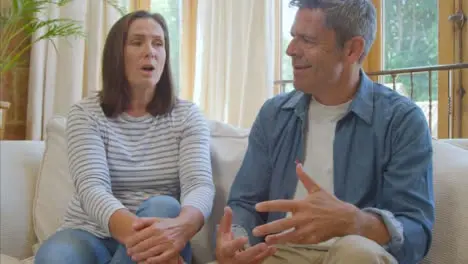 POV Shot of a Visibly Frustrated Middle Aged Couple Talking into Camera During Therapist Video Call