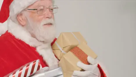 Close Up Shot of Santa Holding Some Presents and Gifts