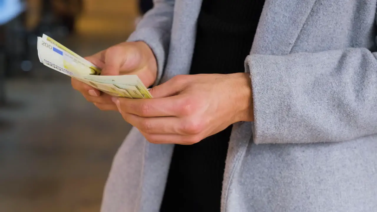 Close Up Shot of Man Counting His Money