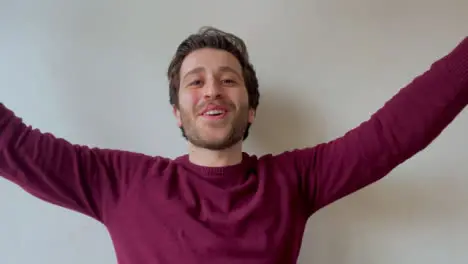 Young Male University Student Singing Happy Birthday Directly to Camera During Video Call