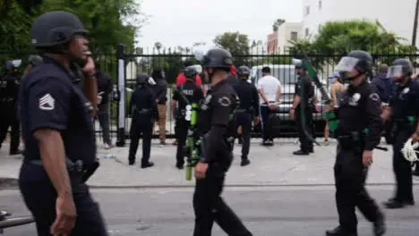 Hollywood Armed Police Officers Watching Arrested Protesters