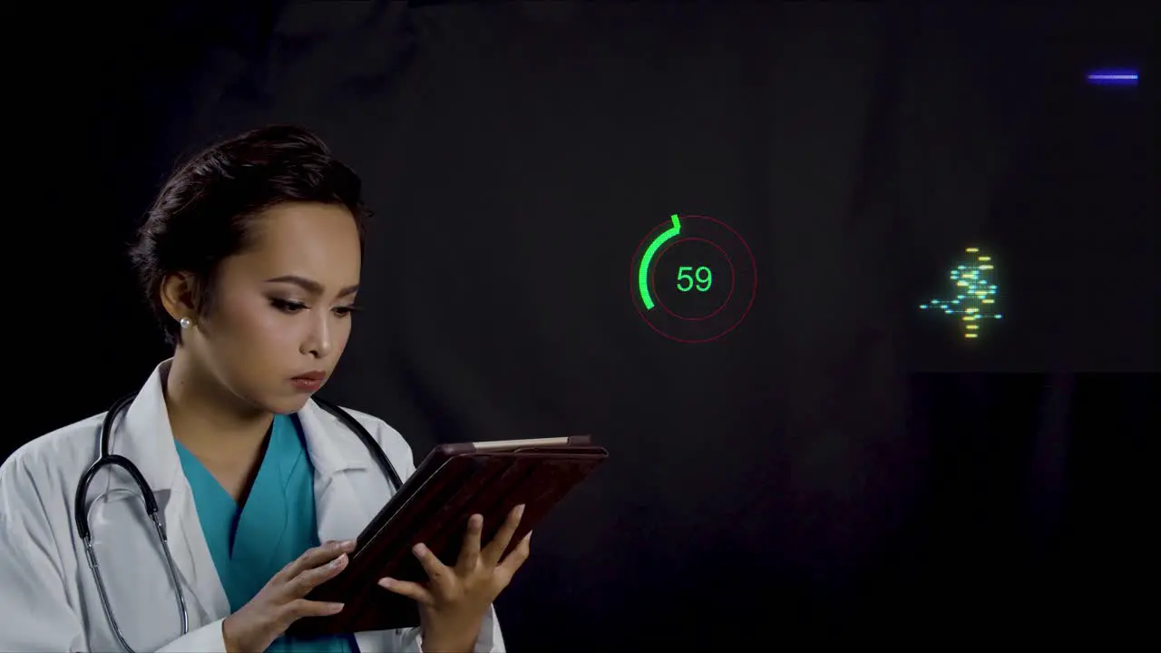 Female doctor or nurse looks at a patient's heart and health data on a tablet with a futuristic display of the data is animated in the background