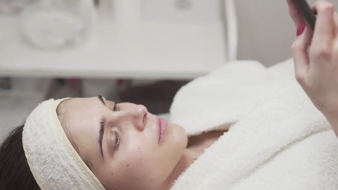 Girl relaxing at the spa while wearing a bathrobe