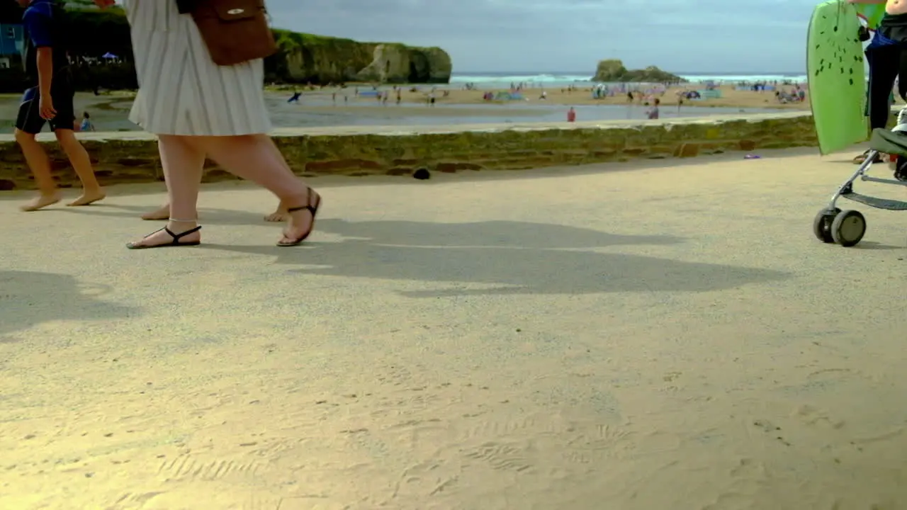 Family's walking back from the beach with buckets and spades