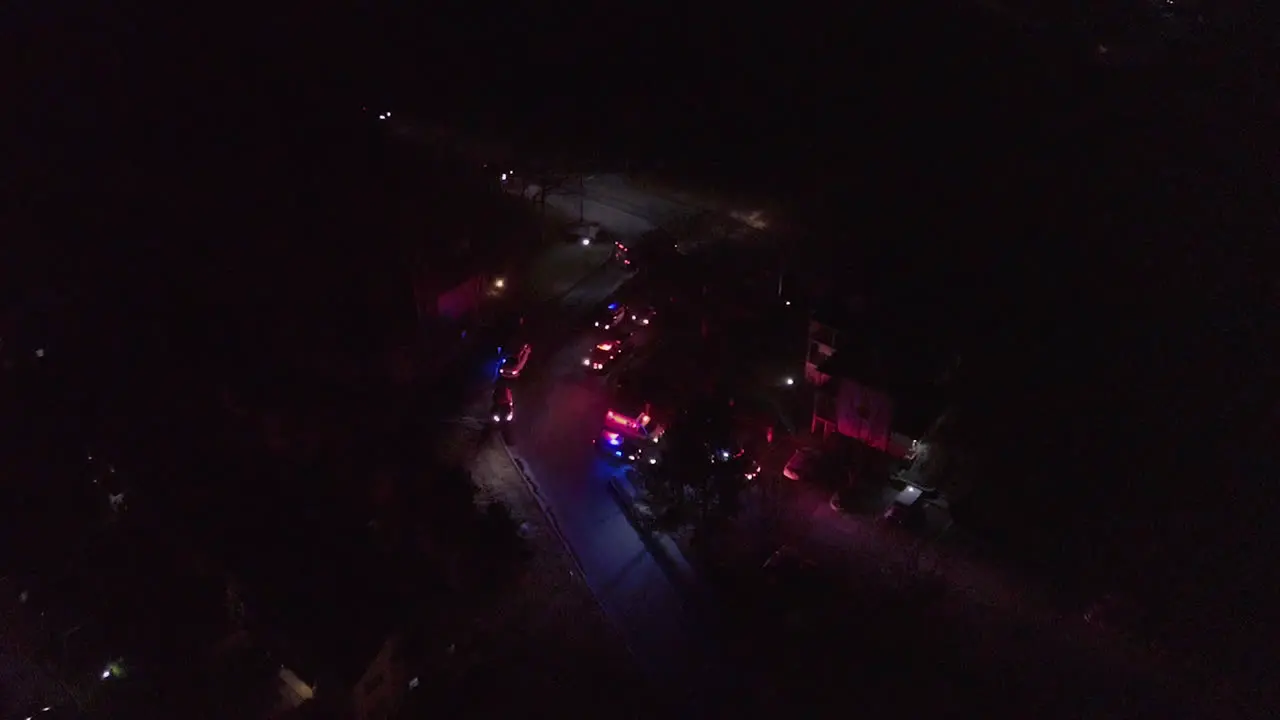 night aerial shot of ambulance and police cars