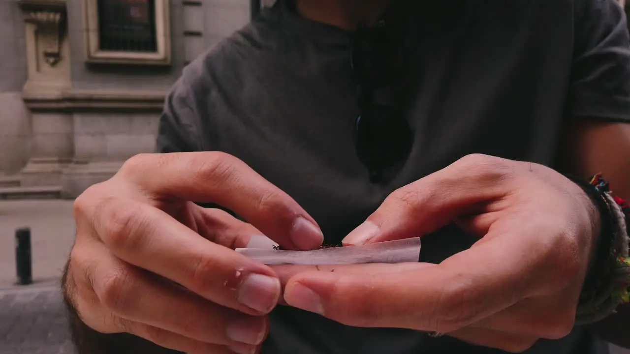 Slow-mo Rolling a tobacco cigarette in 4k