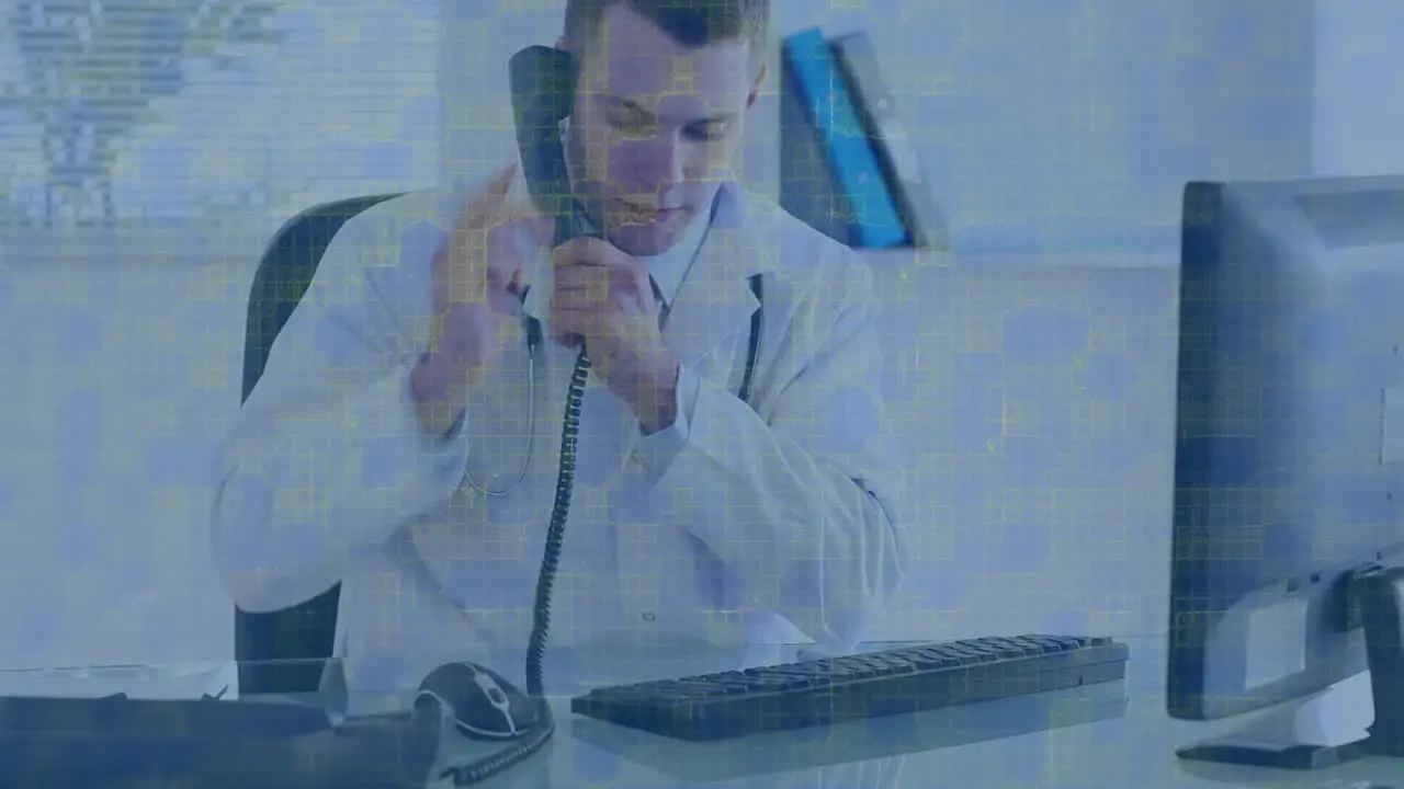 Animation of digital screen over male doctor talking on smartphone using computer