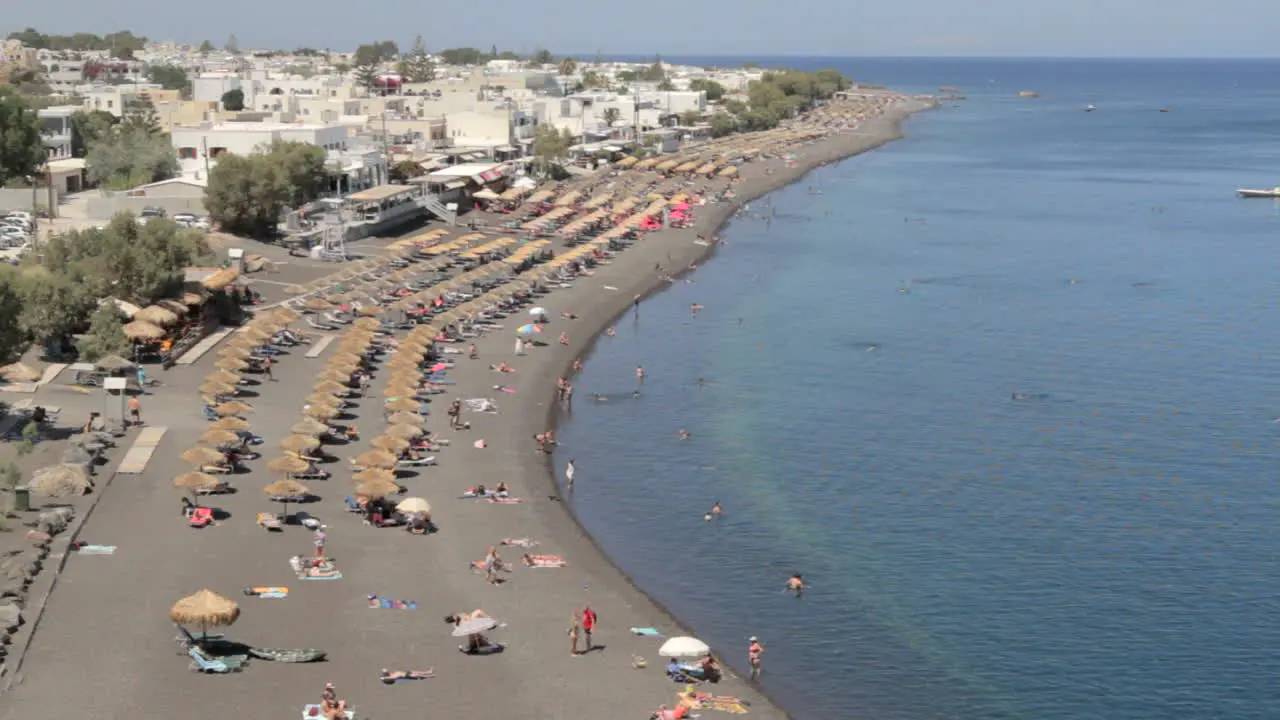 High angle shot of the black peddle beach of Kamari on the island of Santorini Greece