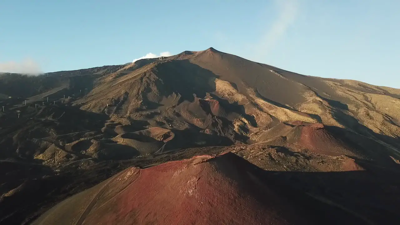 Drone flight over a large crater of the Etna volcano Sicily Italy