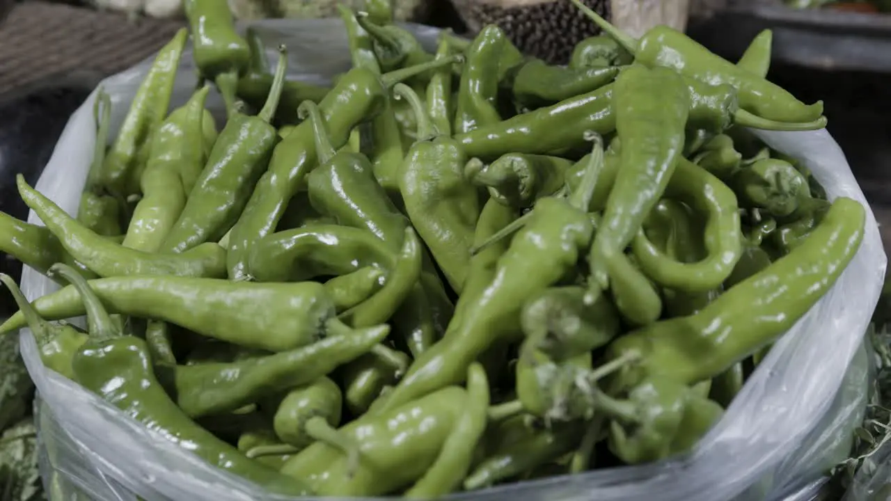 fresh organic green chilli at vegetable store for sale at evening