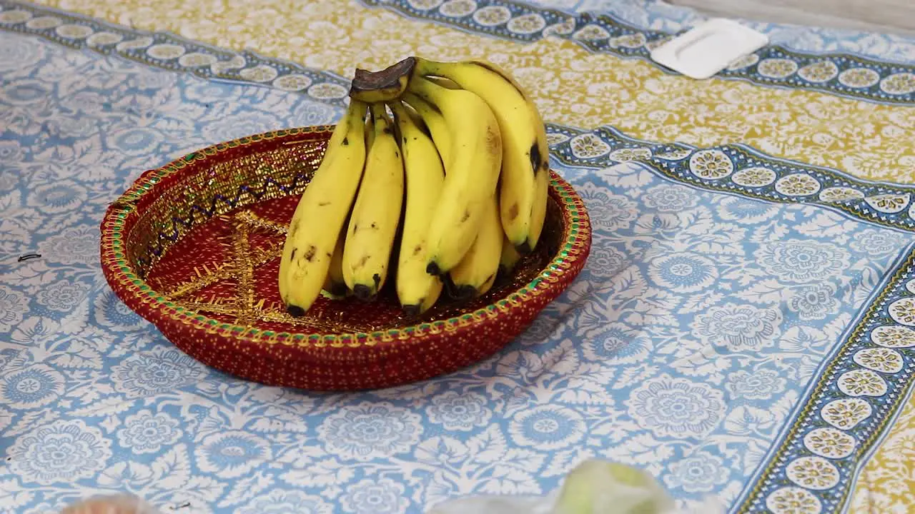 yellow ripe banana kept at decorated plate from flat angle