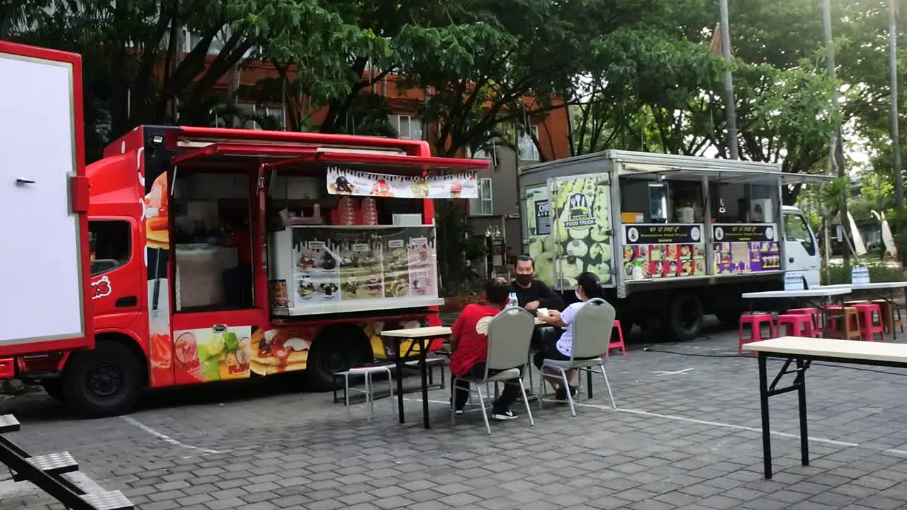 a crowd of food trucks at a bazaar festival Denpasar Bali November 12 2020