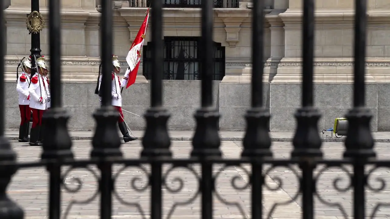 Guards of the Presidential Palace In Peru Marching Seen Through Gates