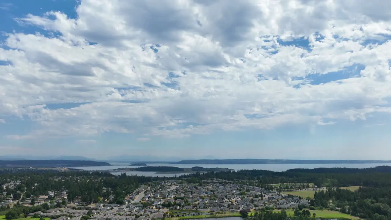 Aerial hyperlapse of clouds passing over Whidbey Island's Oak Harbor community