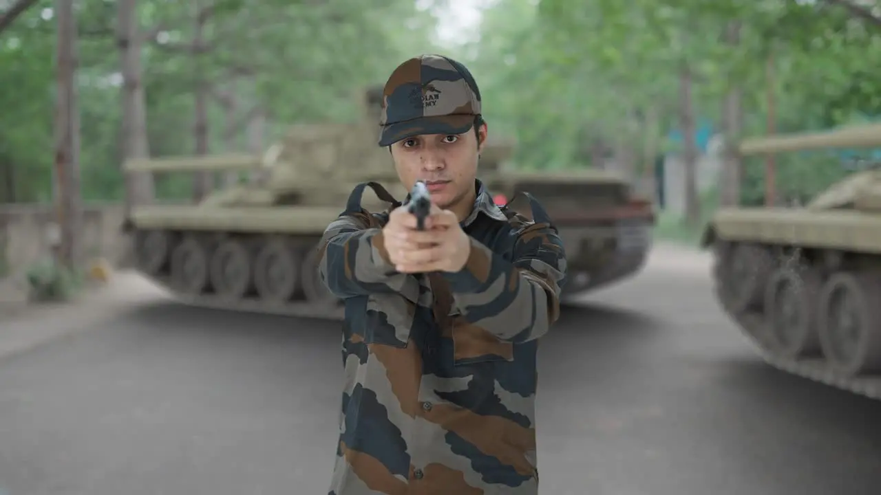 Indian army man aiming with his hand gun