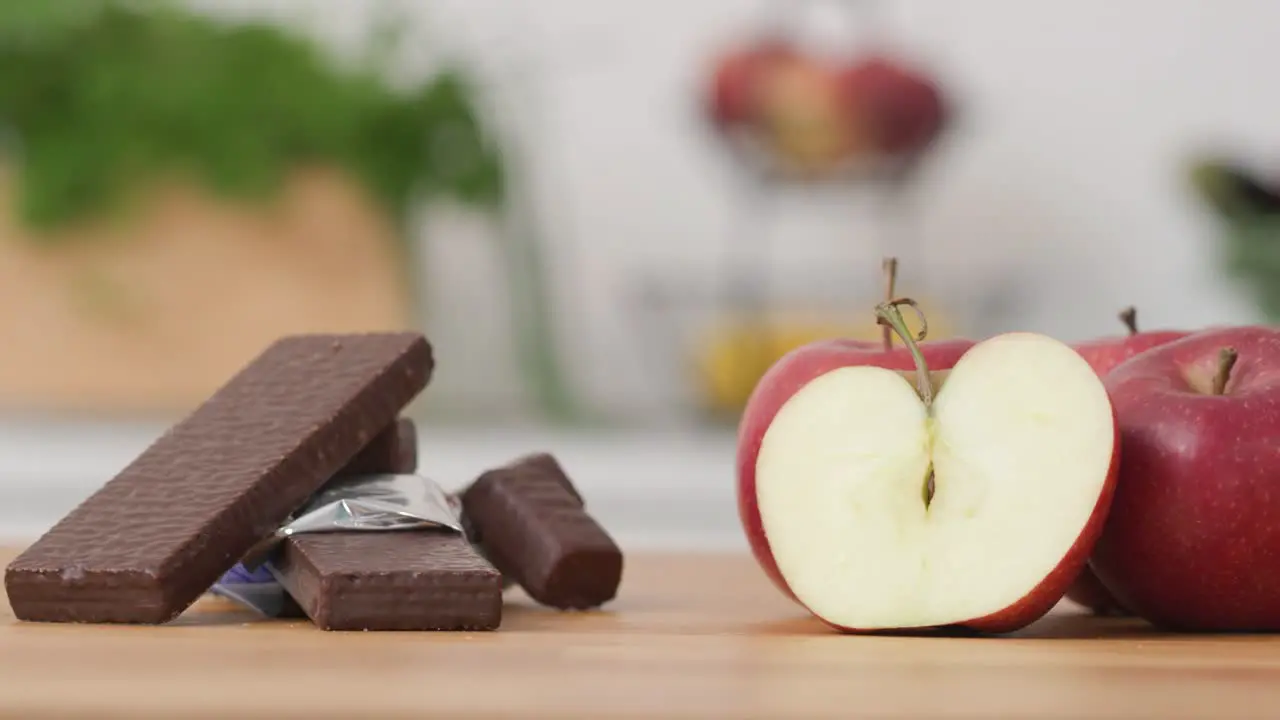 Kitchen worktop with organic apples and sweet chocolate wafer