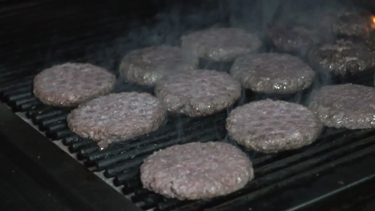 Delicious beef burger cooking hot barbecue grill