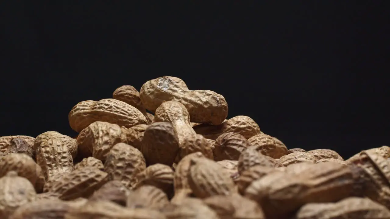 Spinning pile of peanuts with black background