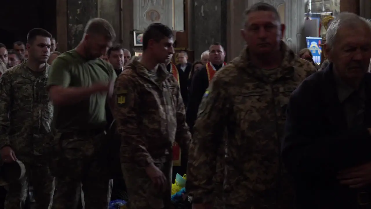 Mourners Pass By And Lay Offerings At The Coffin Of A Dead Ukrainian Soldier During A Funeral Service In Lviv Ukraine