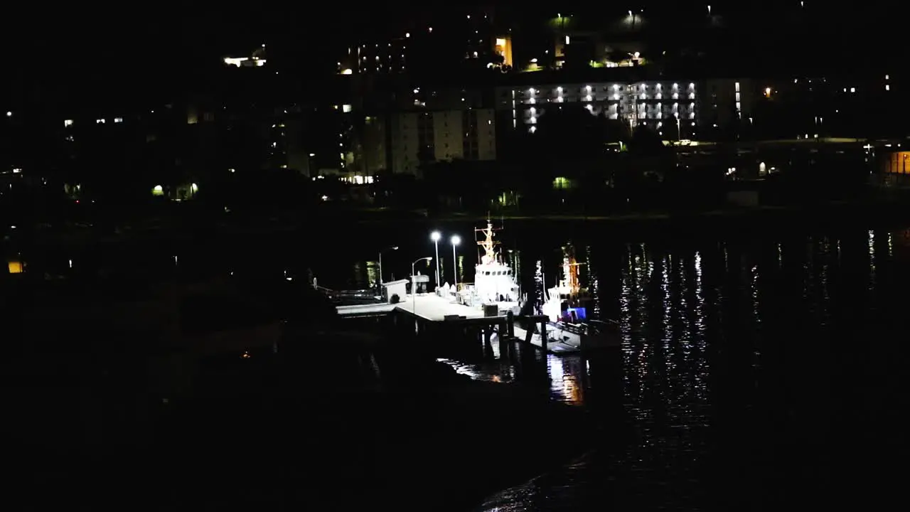 coast guard boat docked at night in san Diego