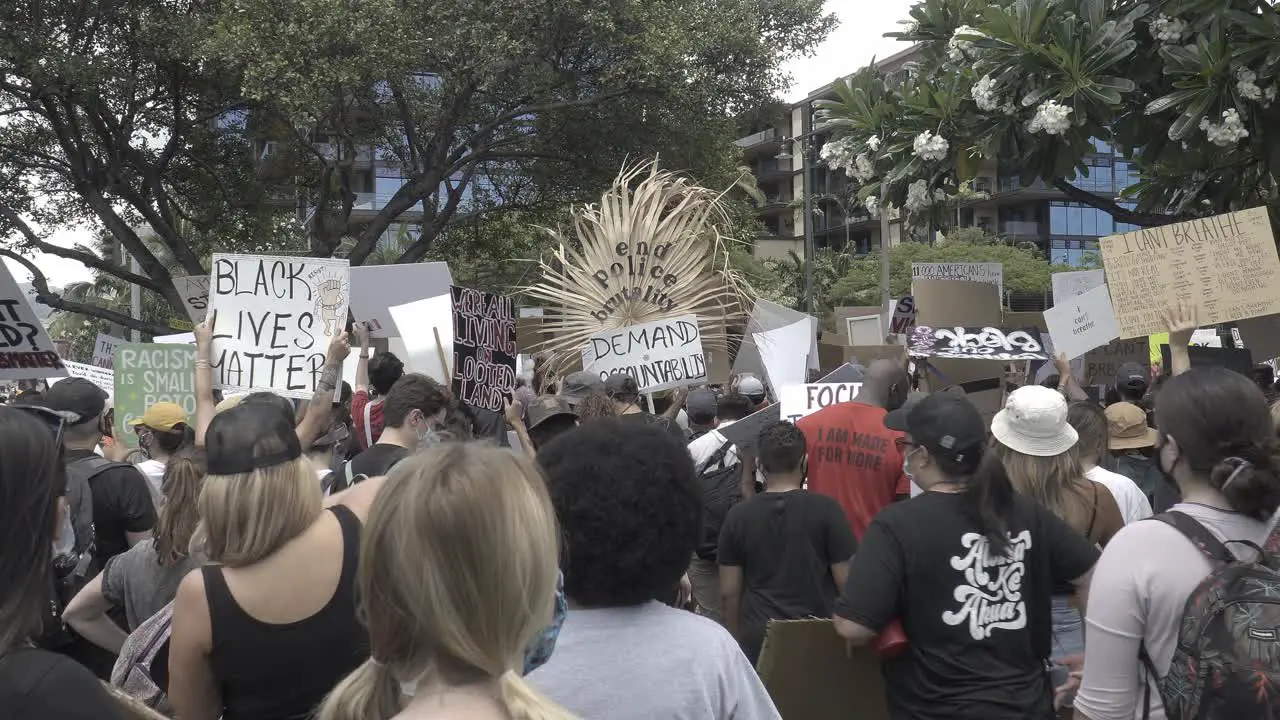 Black lives matter sign holders at a protest in honolulu hawaii