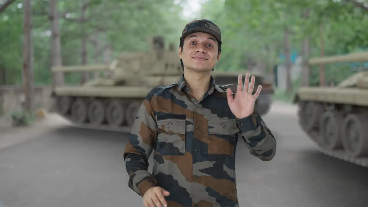 Happy Indian army man waving hello