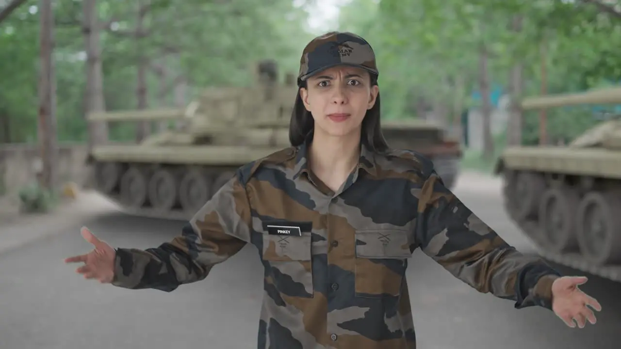 Angry Indian woman army officer shouting on someone