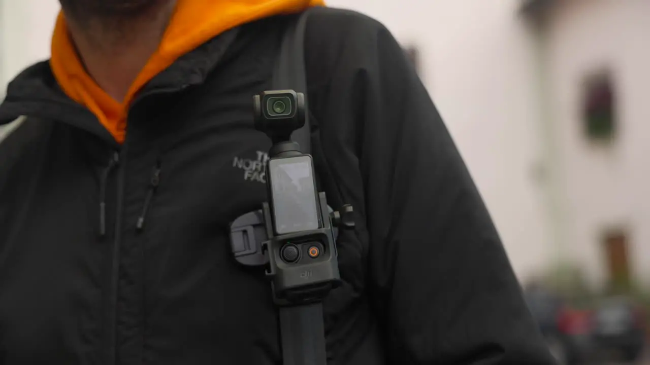 Turning On DJI Osmo Pocket 3 Attached To Camera Clip On Backpack