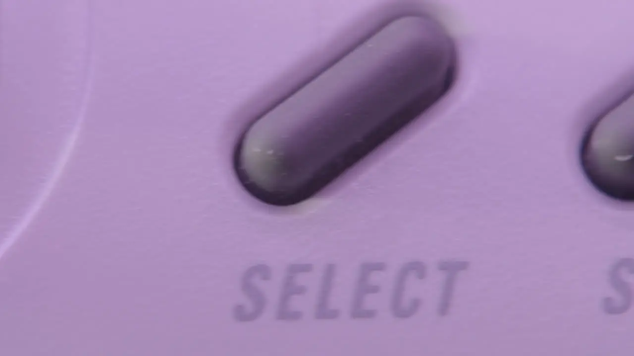 Buttons on Vintage Super Nintendo Controller in Purple Light SLIDE RIGHT