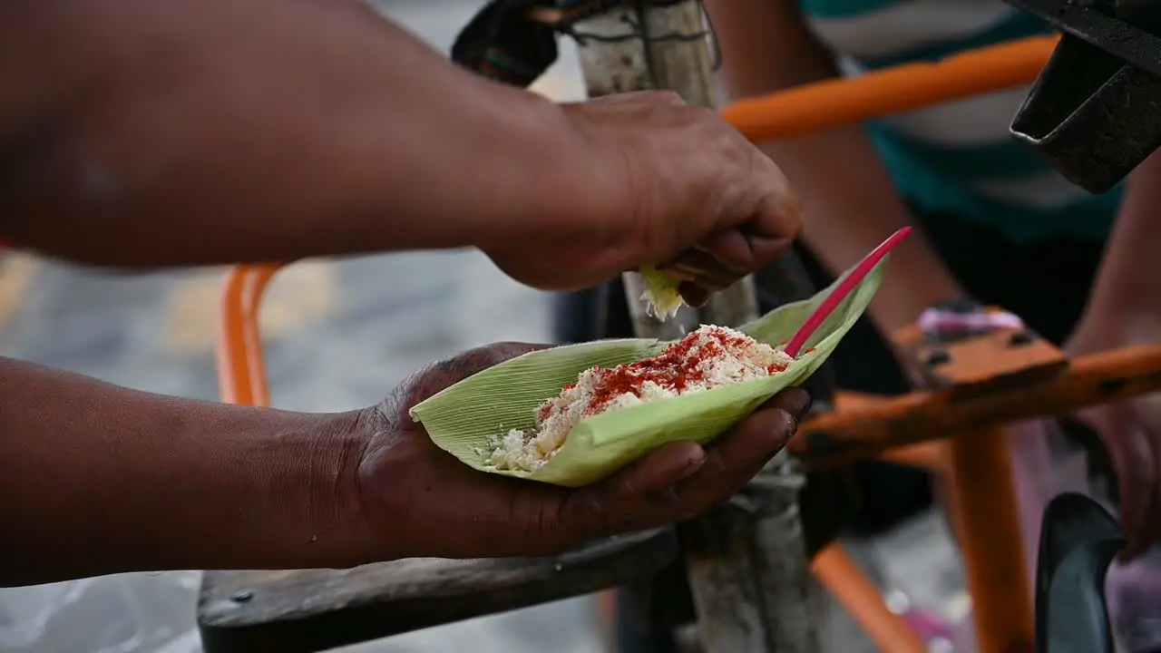 squeezing lemon to Mexican organic corn