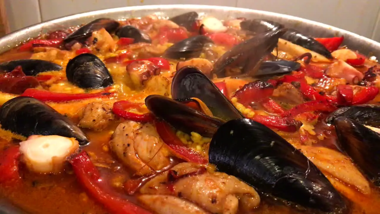 Close up of home made paella dish with prawns mussels and fish traditional Spanish seafood cooking