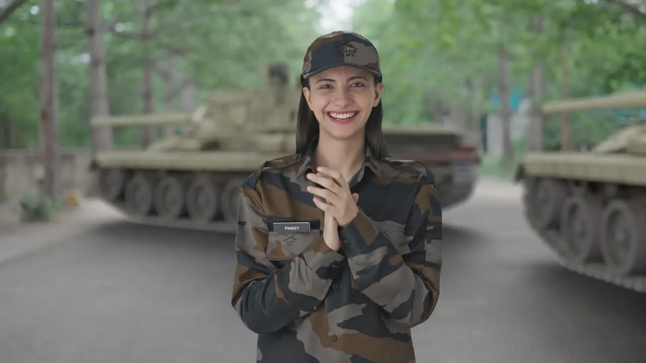 Happy Indian woman army officer clapping and appreciating