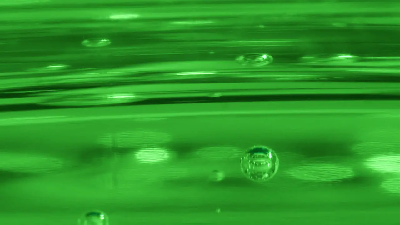 Green matrix liquid in motion close macro