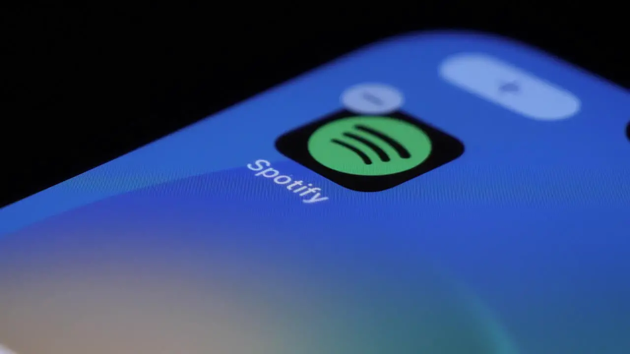 Tapping On Spotify App Icon On Mobile Touchscreen And Deleting It