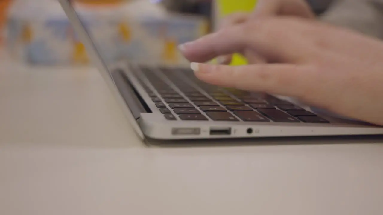 Woman Hands Typing Blog Article On Laptop Computer Keyboard Close Up