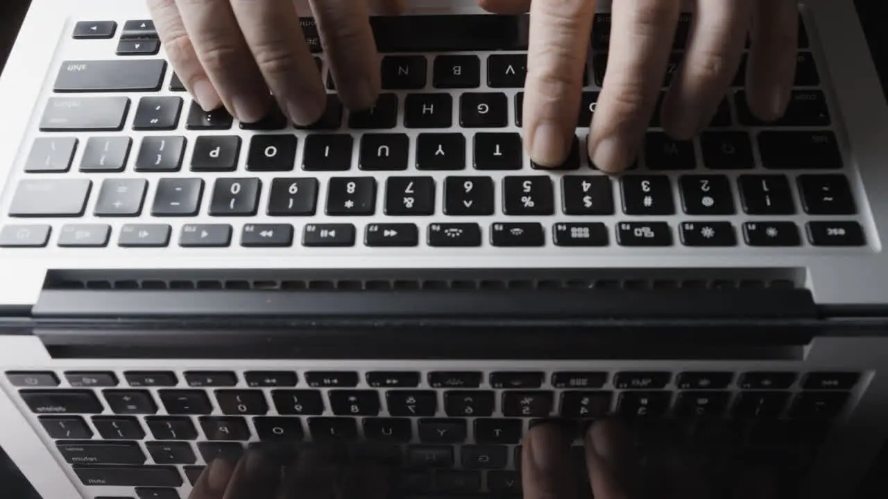 Overhead view of Laptop Keyboard and Fingers