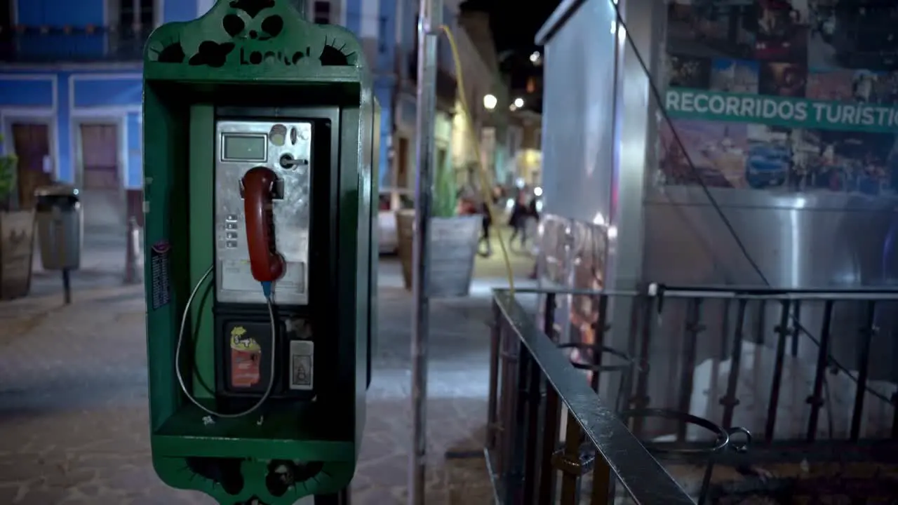 Old telephone booth at night