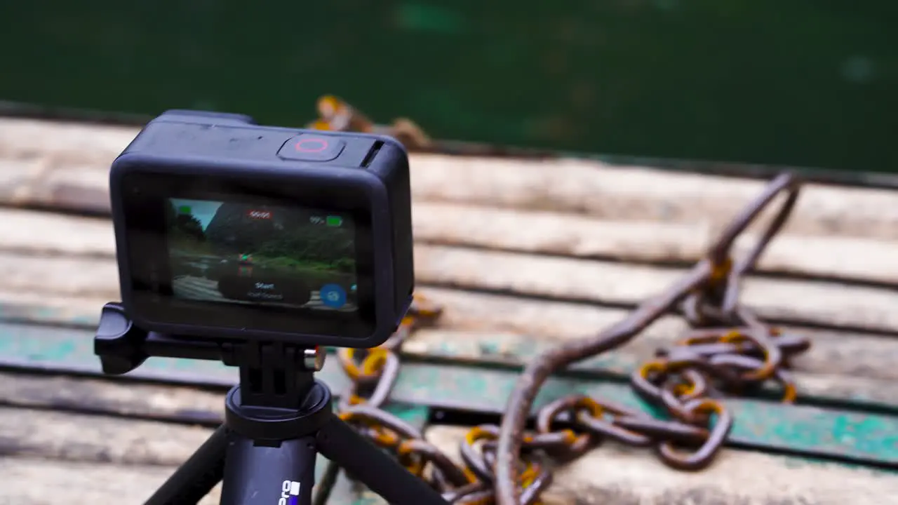 View Of GoPro On Mini Tripod Filming Timelapse On Boat Trip In Vietnam