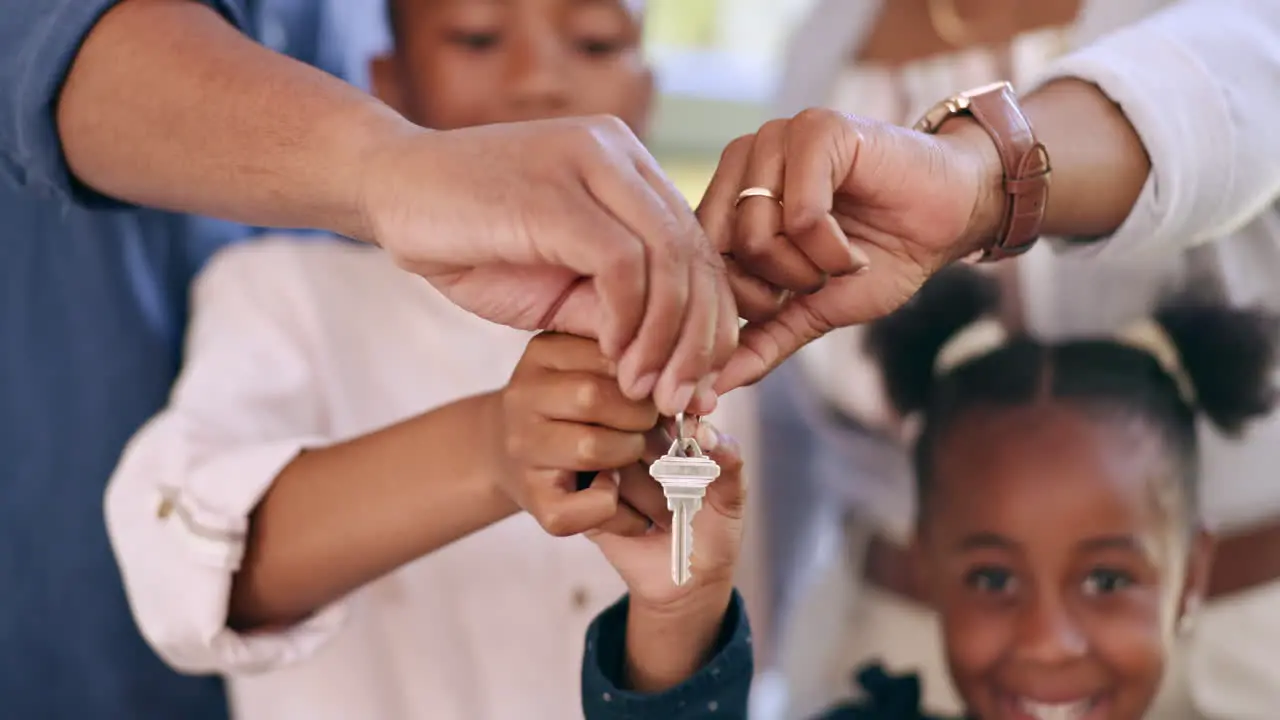 Parents children and hands with house keys of new