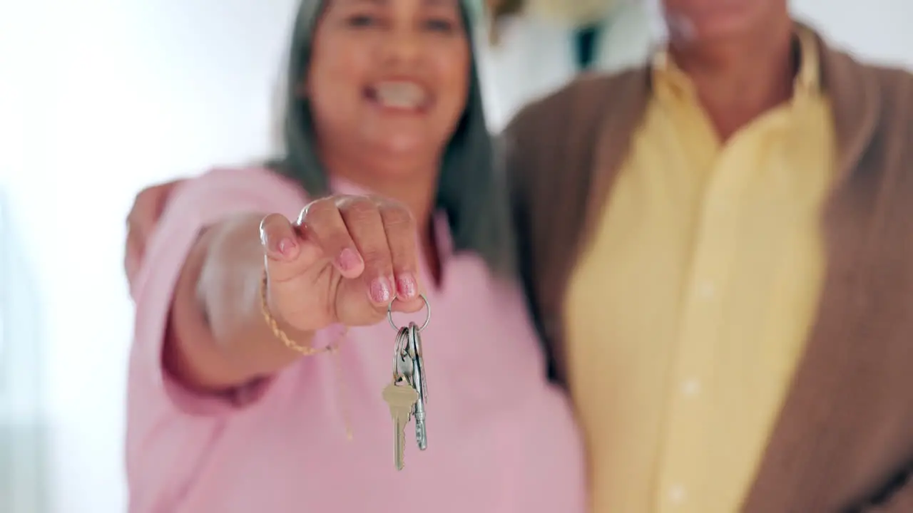 Senior couple happy and house keys with hand