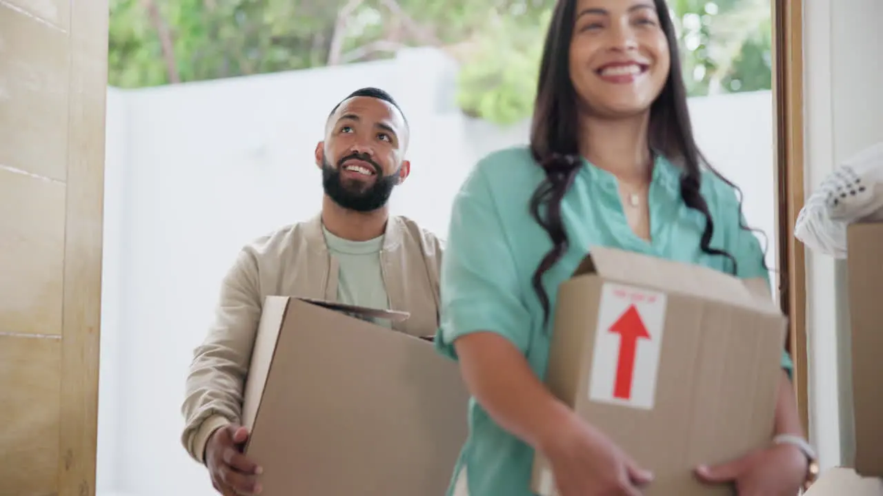 Children moving box and happy family walking