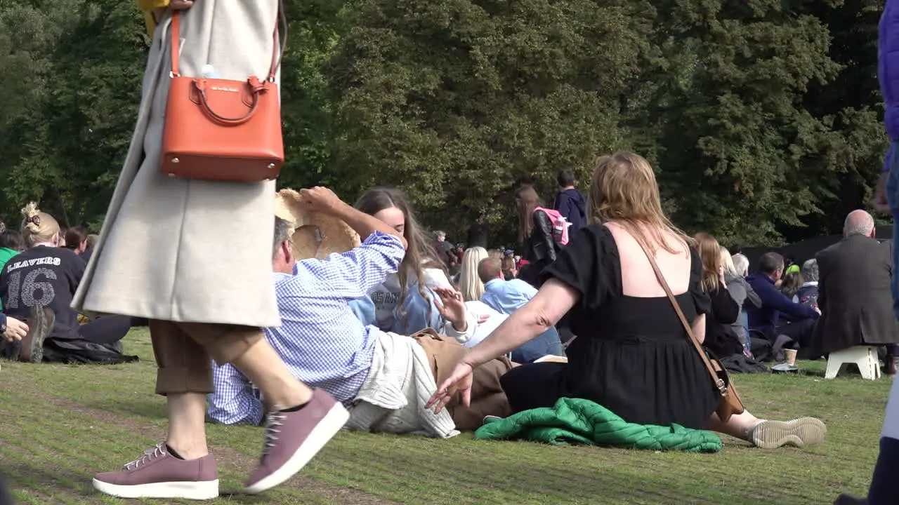 Family go to mourn the passing of the Queen at Hyde Park central London UK