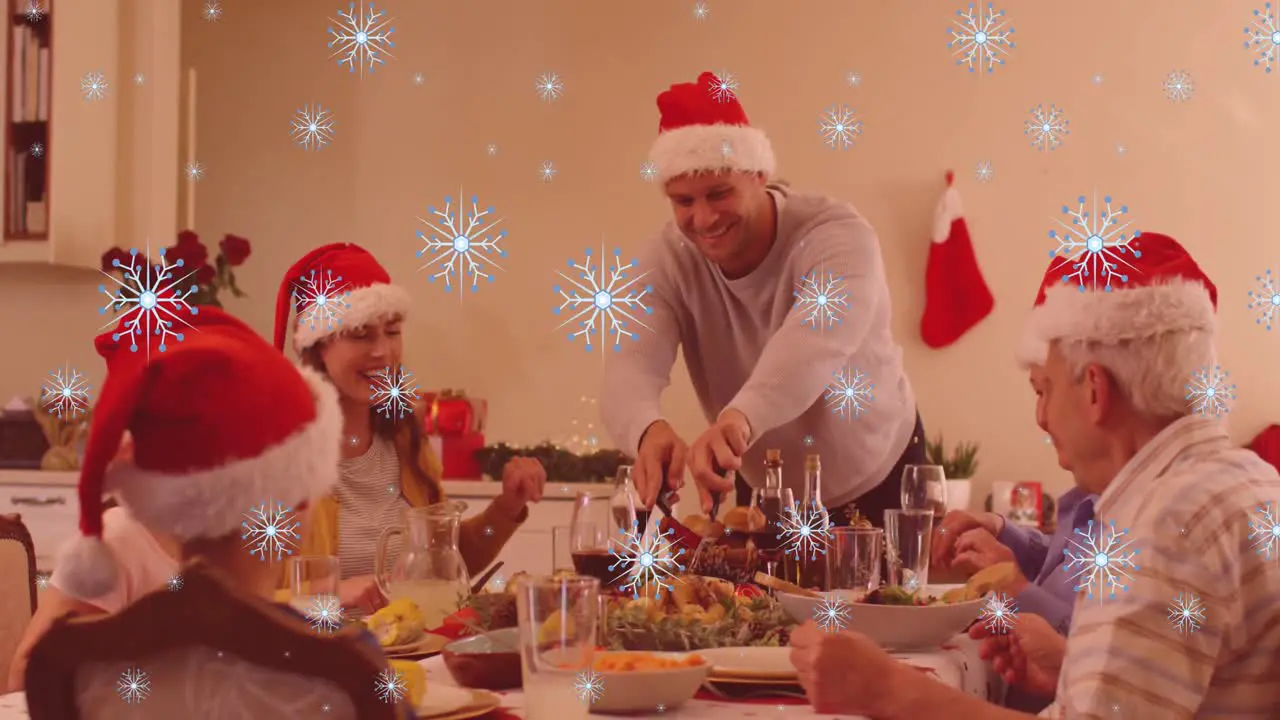 Animation of snow falling over happy caucasian family during dinner at christmas