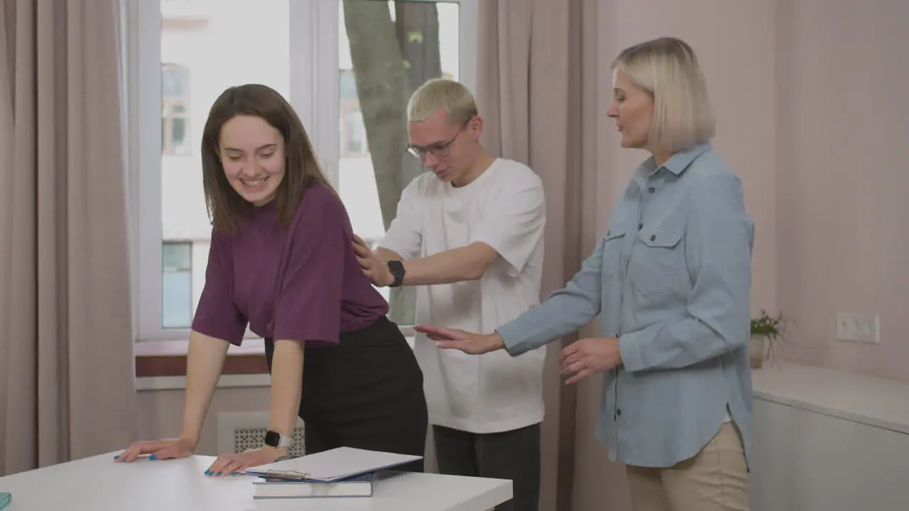 Man learning how to massage his pregnant partner